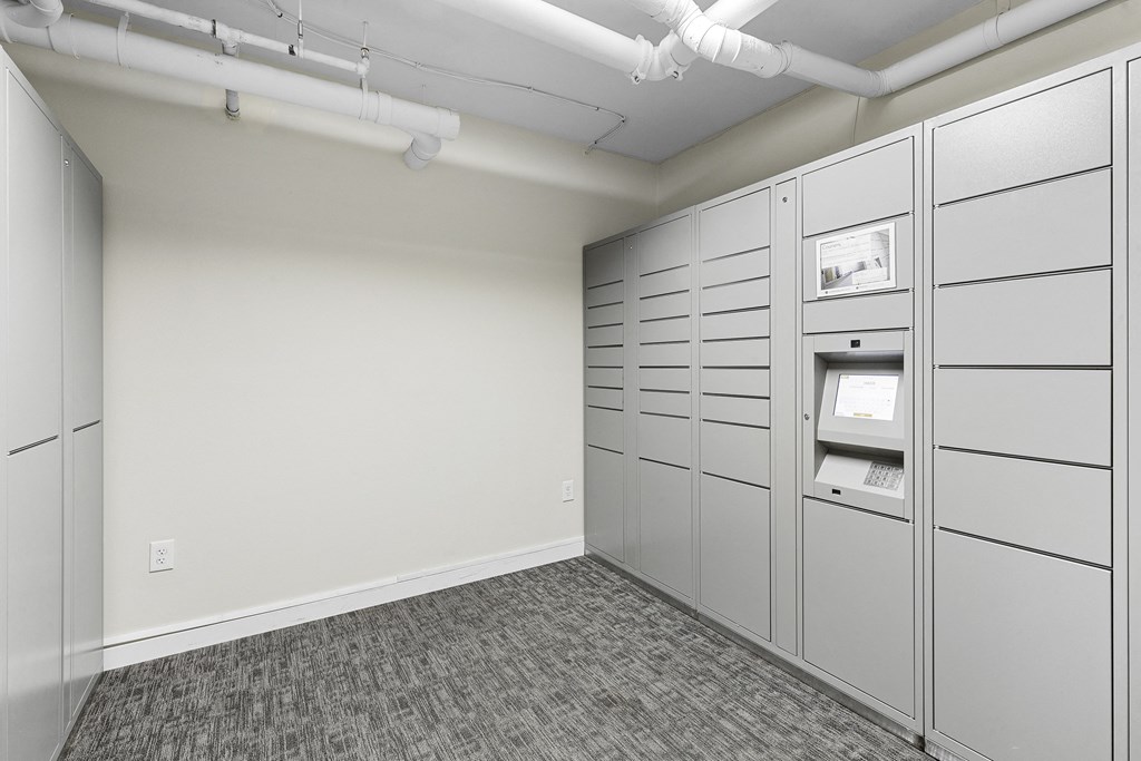 Resident Parcel Receiving Room with Package Lockers and Carpeted Floor  Resident Parcel Receiving Room with Package Lockers and Carpeted Floor at Sir Gallahad Apartment Homes, Washington